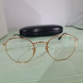 Gafas Ray-Ban redondas, doradas
