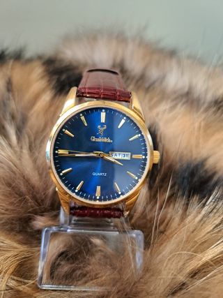 Reloj Glenfiddich azul y dorado