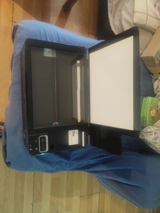 Impresora Epson negra en buen estado.