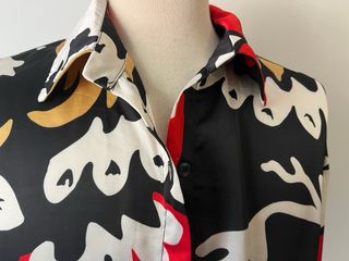 Blusa amplia