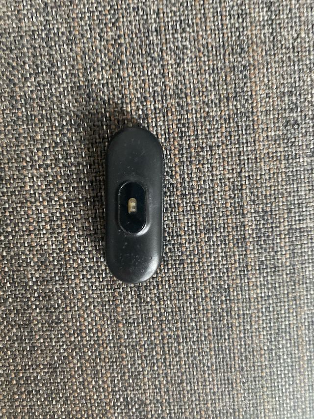 Pulsera de actividad con cargador