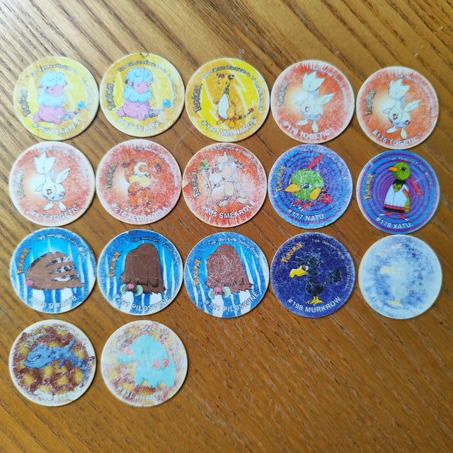Mix 64 tazos Pokémon + Portatazos Beyblade