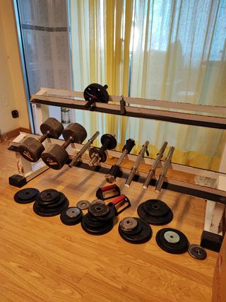Banco pesas + discos musculación