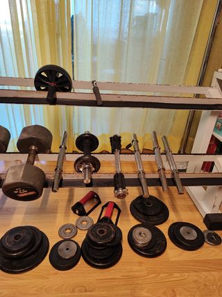 Banco pesas + discos musculación