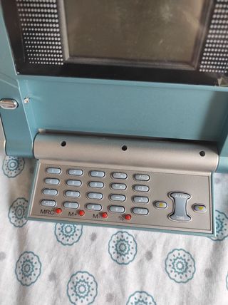 Teléfono antiguo azul y plata