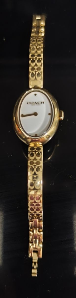 Reloj Coach dorado mujer