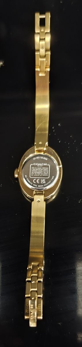 Reloj Coach dorado mujer