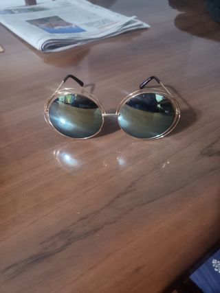 Gafas sol redondas doradas