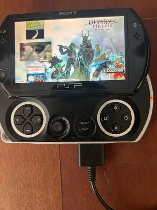 PSP Go negra + cargador + juegos