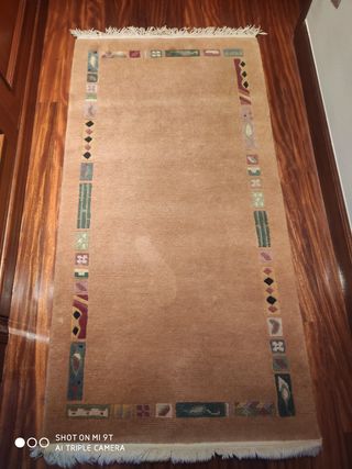 Alfombra pie de cama de lana marrón multicolor