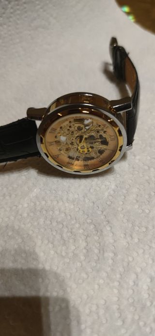 Reloj esqueleto dorado y plateado