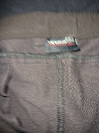 Chaqueta The North Face negra y pantalon ternua