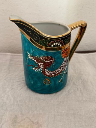 Tazza e piattino in porcellana decorati