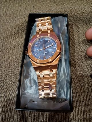 Reloj dorado cobre con esfera azul automático 