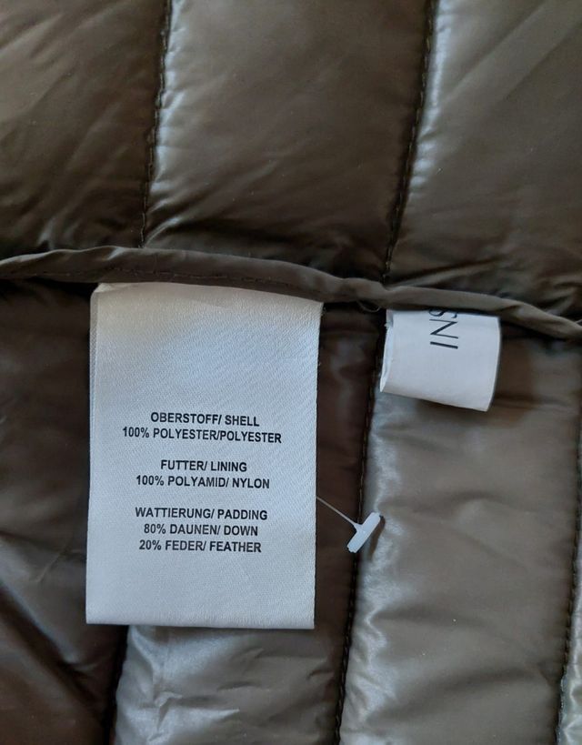 Giacca in piuma verde oliva con pois