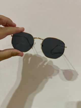 Gafas sol redondas doradas