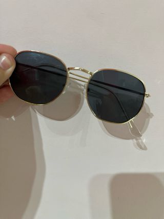Gafas sol redondas doradas