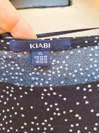 Vestito nero a pois bianchi