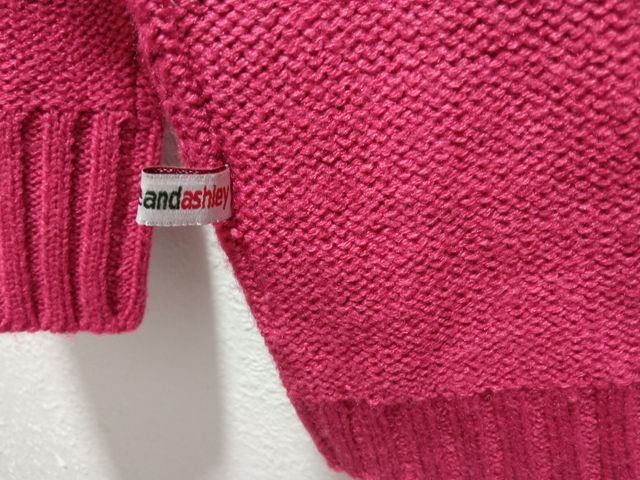 Cárdigan fucsia con cierre tipo trenca