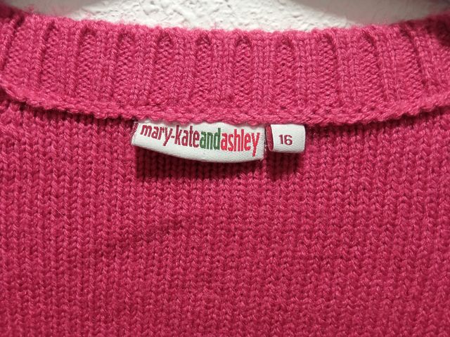 Cárdigan fucsia con cierre tipo trenca