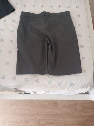 Pantalón corto gris uniforme
Tabla 9-10