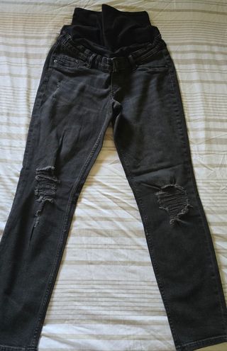 Pantalones premamá rotos negros elásticos.