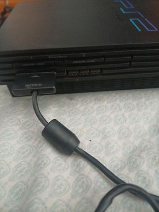 PlayStation 2 negra - 2 juegos