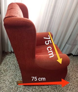Mecedora  naranja de tela y madera