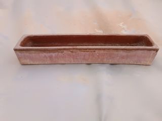 Comedero antiguo barro pollos