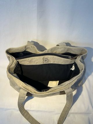 Bolso bandolera de tela beige y cuero marrón