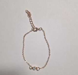 Pulsera dorada circonita blanca