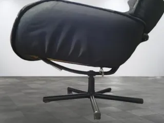 Sillón reclinable negro tela y metal.