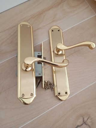 Manillas puerta doradas
