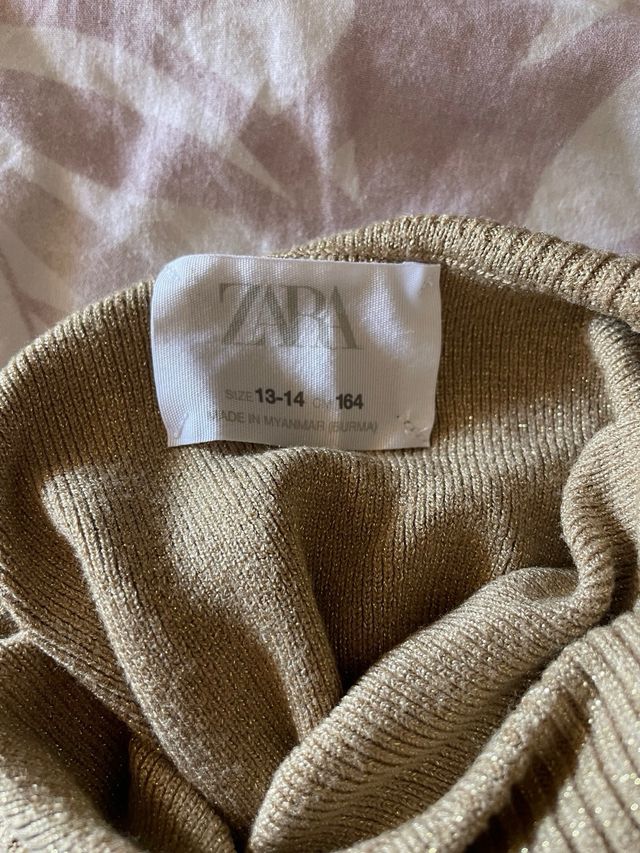 Jersey cuello alto dorado Zara