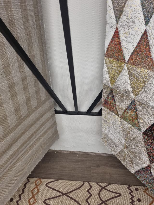 Expositores alfombras de pared