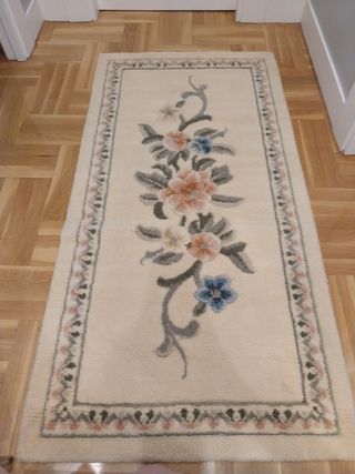 Juego de 2 alfombras de lana beige-rosa.