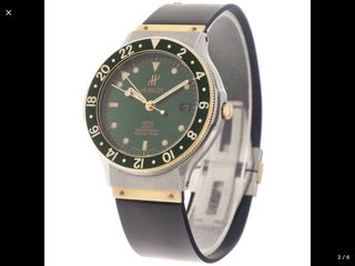 Reloj Hublot Classic MDM GMT Verde en acero y oro.