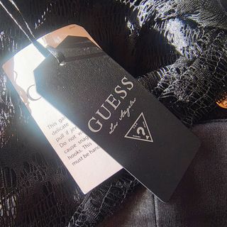 Top GUESS peplum negro encaje brillo