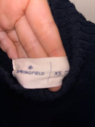 Suéter de punto azul oscuro