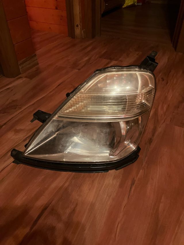 Farol esquerdo Honda