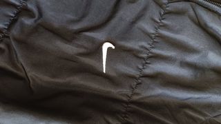 Piumino Nike nero con cappuccio