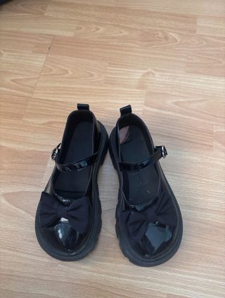 Mocasines negros con lazo