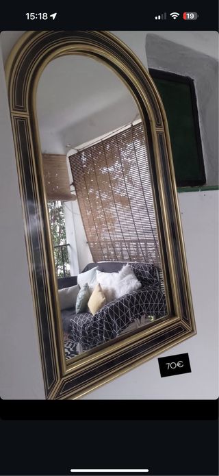 Espejo arqueado negro y dorado
