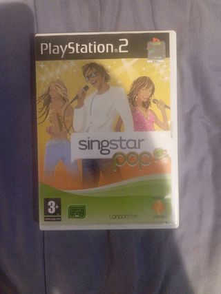 PS2 (PlayStation 2) + 2 mandos + 2 micrófonos