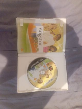 PS2 (PlayStation 2) + 2 mandos + 2 micrófonos