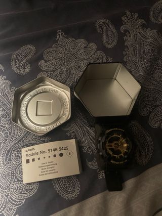 G-Shock Reloj - Negro y Dorado