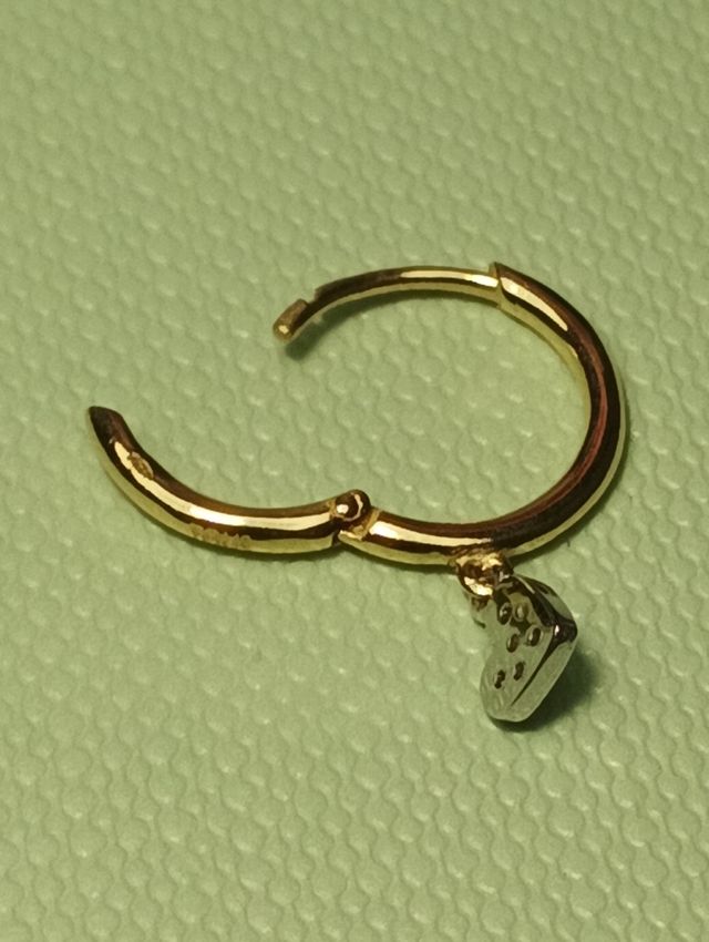 Tous piercing criolla oro 18k y brillantes.