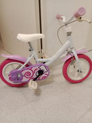 Bicicleta infantil rosa y blanca