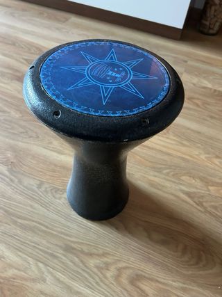 Timbal con diseño de brújula