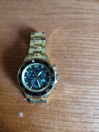 Reloj Lacotte, dorado tiene dos puestas.